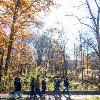 Group walking behind the dorms